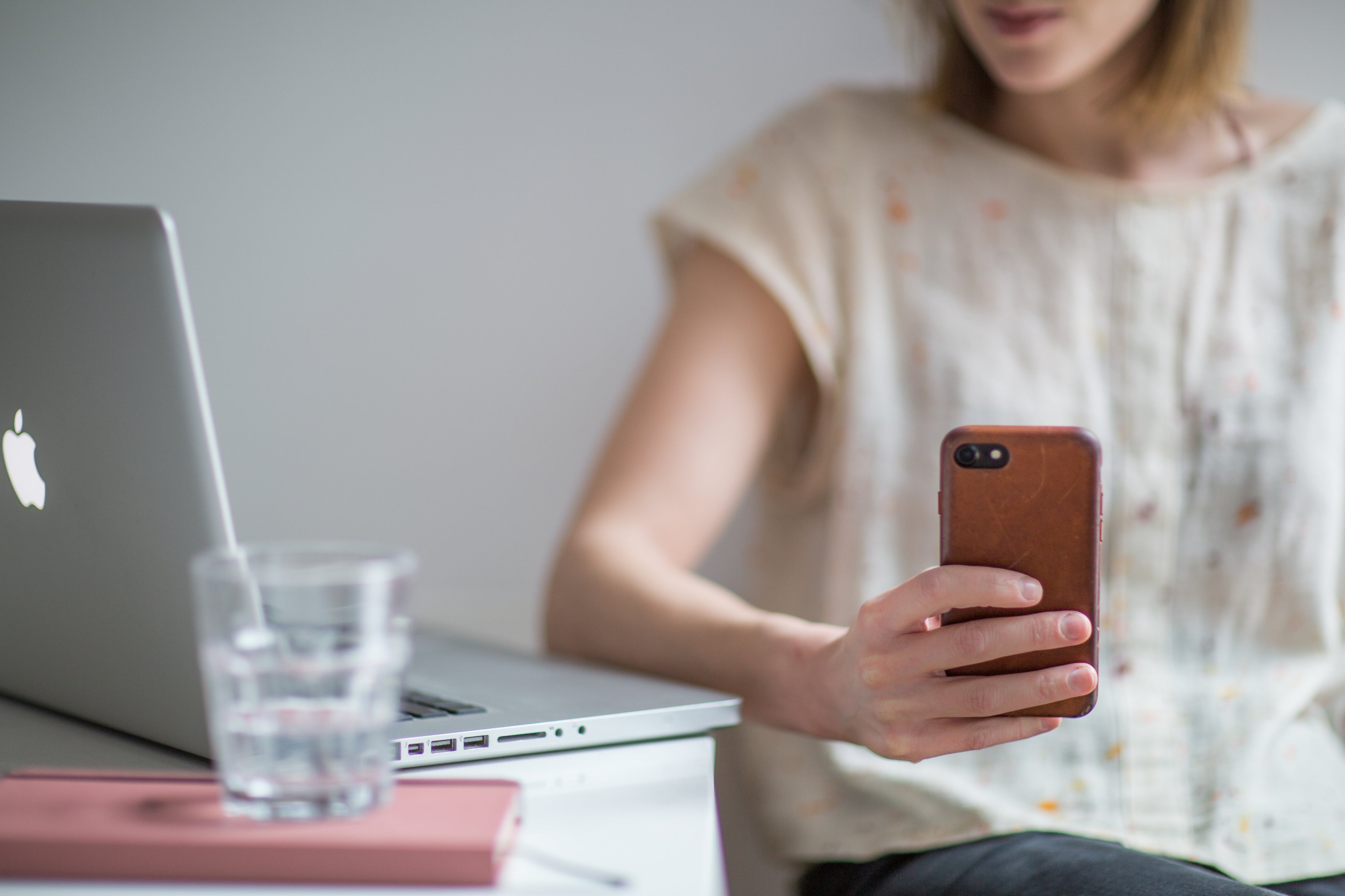 Woman using a cell phone taking a break from work